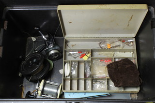 A large Daiwa tackle box containing reels, etc, etc, 