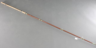 An Avon style carbon fibre fishing rod with detachable butt