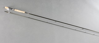 A Bob Church graphite  twin section carbon fibre fishing rod 