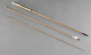 An Allcocks big game twin section split cane fishing rod complete with slip
