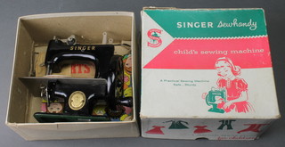 A childs Singer manual sewing machine, model no.20, boxed