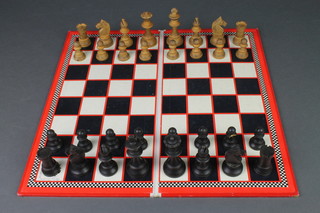A black and white Staunton patent wooden chess set, together with a paper board by Marchant Games 