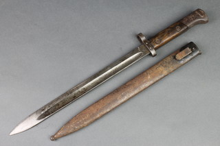 A Continental bayonet, the 11 1/2" single blade marked  E26 CSZ complete with metal scabbard 