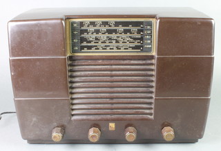 A Philco radio contained in a black Bakelite case 
