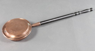 A copper warming pan with engraved lid and turned ebony handle 