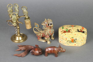 A shaped lacquered box decorated Polo scenes 4", a Chinese gilt and jewel studded scent bottle in the form of a seated Dog of Fo 3 1/2", a carved wooden figure of a carp, ditto hippo and a bottle opener stand  
