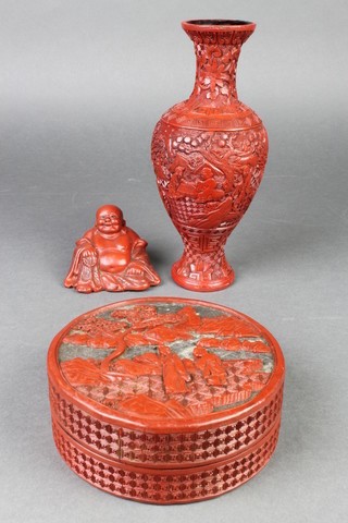 A cinnabar lacquered club shaped vase 9", ditto circular jar and cover 5", figure of a seated Buddha 2"