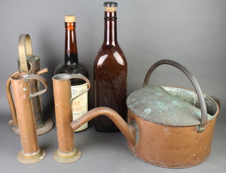 A large copper brewing jug 14", 2 copper jugs 12", copper filter 17", 2 large glass novelty bar advertising bottles