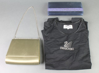 A Swarovski T shirt, size XL together with 2 Swarovski evening bags 
 