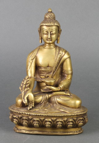 A gilt bronze figure of a seated Buddha 8" 