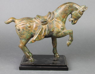 A bronze figure of a standing Tang horse raised on a marble base 10"