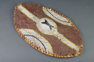 An oval tribal hide shield 18" x 10" 