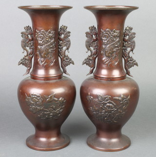 A pair of 19th Century Japanese club shaped bronze twin handled vases with dragon handles decorated birds 12" 