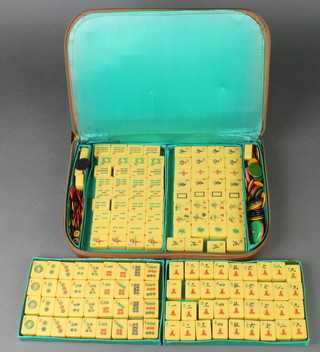 A plastic Mahjong set with 4 wooden boards