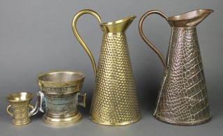 A waisted copper jug 11", brass jug 10", a twin handled bell metal mortar 5" etc