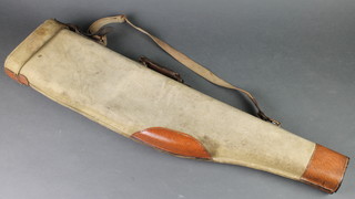 A canvas and leather leg of mutton gun case 