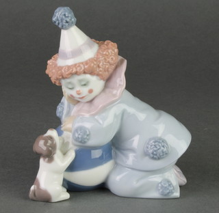 A Lladro figure of a kneeling child clown and puppy 5274 8" 