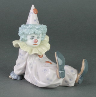 A Lladro figure of a seated child clown no. 5512 4"  