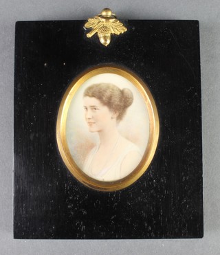 Miniature watercolour, an oval study of a young lady in a ebonised acorn mounted frame 2" x 1 1/2" 