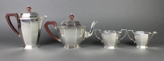 An octagonal silver 4 piece tea and coffee set with fruitwood mounts, London 1937, gross 1414 grams
