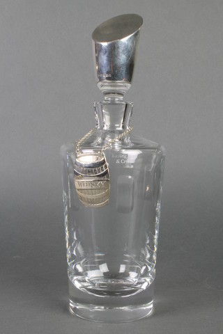 A studio decanter with shaped Sterling mounted stopper and plated label 