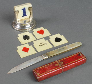 A silver and mother of pearl fruit knife in a Moroccan case and a silver card suit holder 