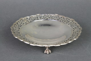 A silver dish with cut rim, raised on claw and ball feet, Birmingham 1912, 252 grams 