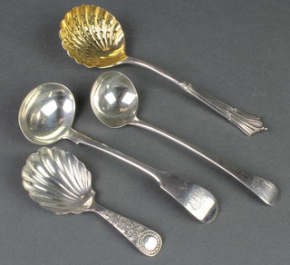 A Georgian silver caddy spoon with shell bowl and 3 other spoons
