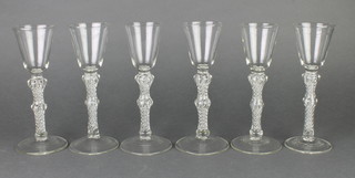 A set of 6 Georgian style cordials with air twist stems and broad foot 7 1/2" 