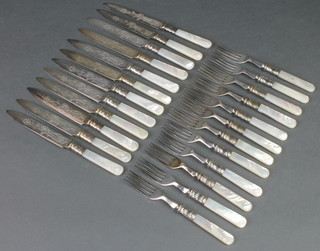 A set of silver plated and mother of pearl handled dessert eaters for 12 