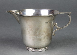 A Victorian silver cream jug with S scroll handle, London 1897, 102 grams