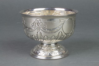 An Edwardian repousse silver pedestal bowl with swag ribbon and demi-fluted decoration with vacant cartouches, Birmingham 1912, 124 grams