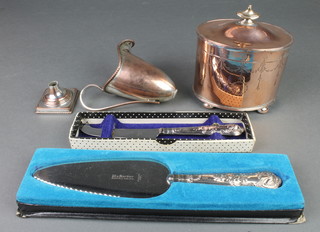 A 19th Century oval silver plated chased tea caddy, a cream jug and 2 knives