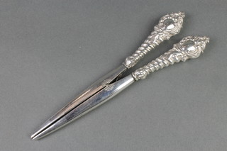 A pair of silver handled spiral glove stretchers