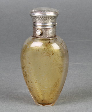 A white metal mounted glass scent bottle