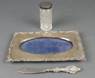 A silver mounted toilet bottle and 2 other items