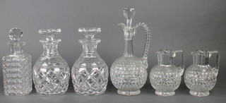 A pair of Georgian design hobnail cut mallet shaped decanters and stoppers, 2 other decanters and a pair of jugs 