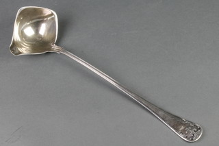 A silver plated ladle with fancy handle