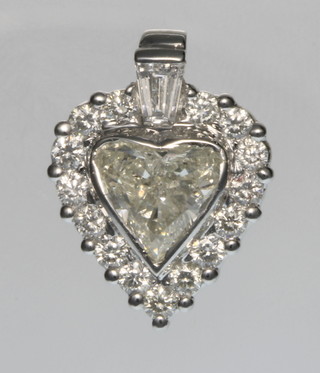An 18ct white gold heart shaped diamond pendant, the centre stone approx. 1.81ct, surrounded by brilliants approx. 0.6ct, together with an IGL certificate 