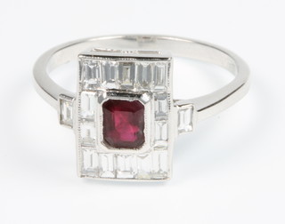 An 18ct white gold ruby and diamond Art Deco style cluster ring, size O