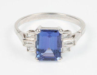 An 18ct white gold Art Deco style tanzanite and diamond stepped mount ring, the centre stone approx. 2.90ct, size M 1/2