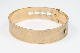 A 9ct gold buckle style bangle, 14 grams 