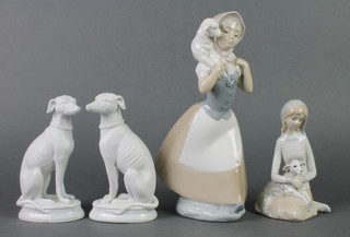 A Victorian pair of bisque figures of seated hounds 6 1/2", 2 Continental figure groups  