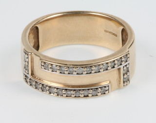 A 9ct gold diamond set band, size N