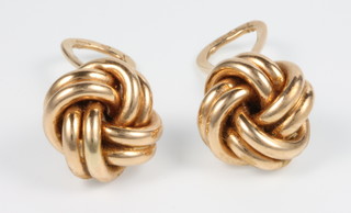 A pair of 14ct yellow gold whorl ear clips, 6 grams