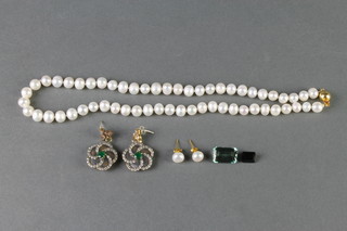 A fresh water pearl necklace and ear studs, a pair of gem set earrings and a loose green amethyst stone and green tourmaline stone 