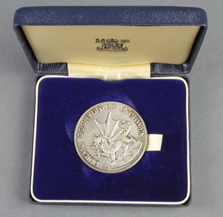 A cased commemorative crown Prince of Wales Investiture medal 1969, together with a cased set of 3 silver Concord postage stamps, 48 grams 