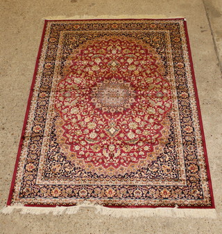 A red ground Belgian cotton Persian style rug with central medallion 69" x 63 1/2" 