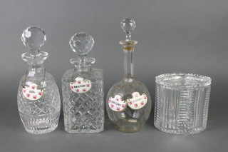A cut glass oval biscuit box and cover 8" and 3 decanters with enamelled lables