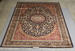 A blue and red ground floral patterned Persian style Belgian cotton carpet 109" x 78" 